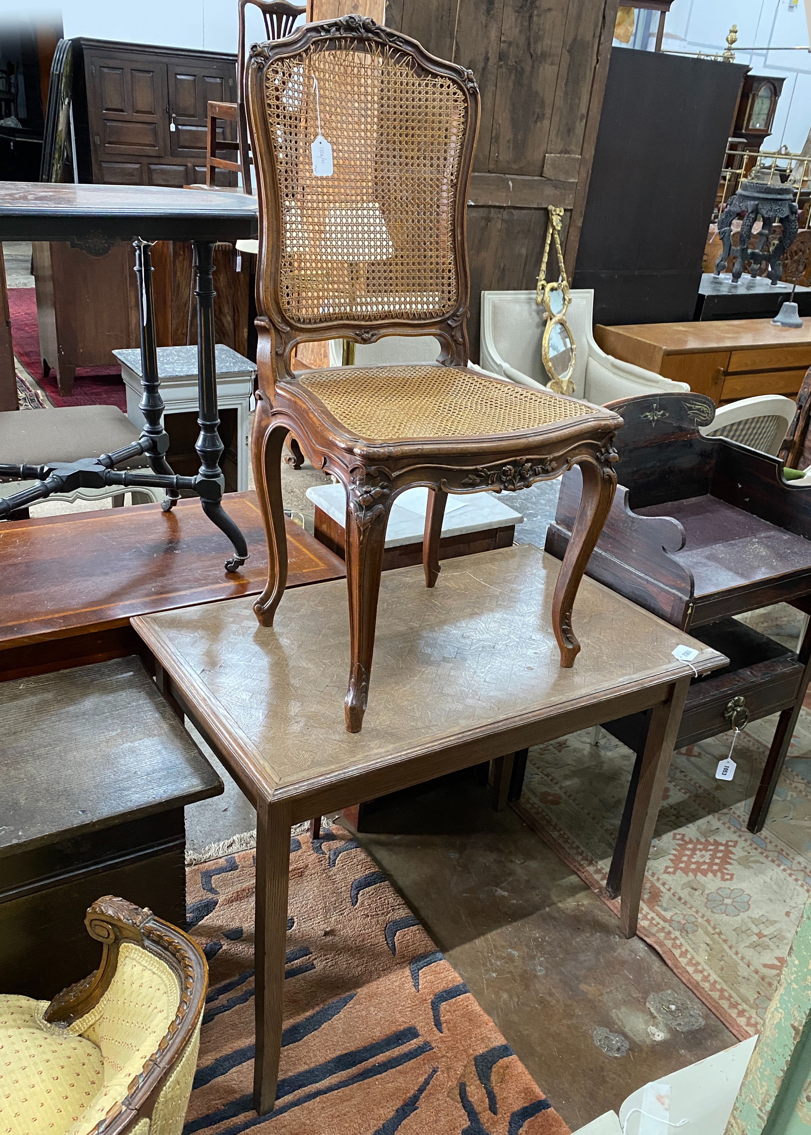 An early 20th century rectangular oak parquetry side table, width 92cm, depth 57cm, height 71cm together with a French caned side chair